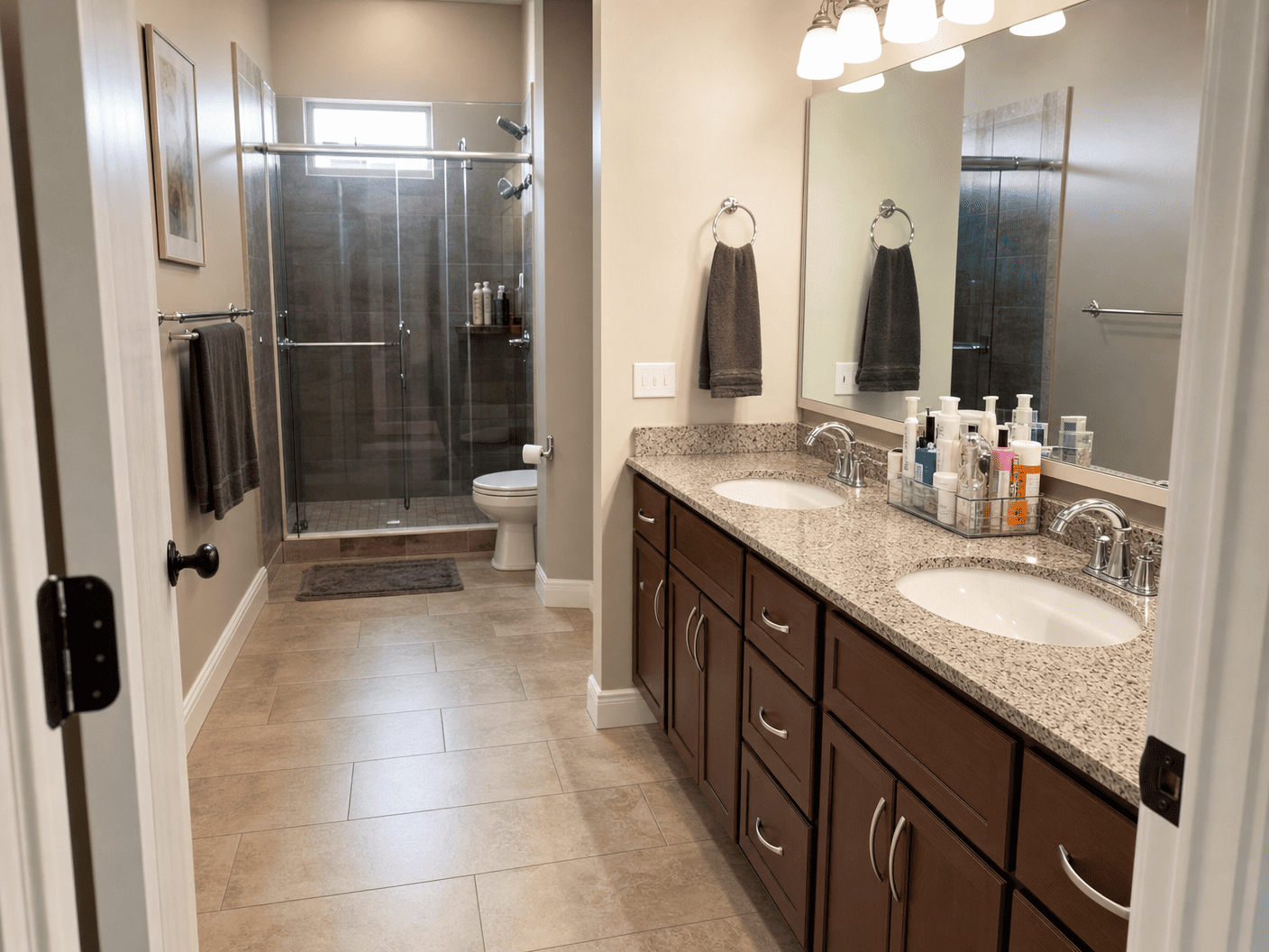 Clean bathroom with double vanity and glass shower